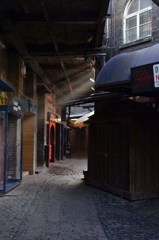 Cobbled alley with market stalls