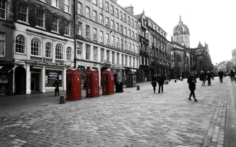 Cobbled street with red phone booths