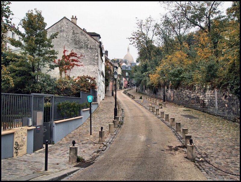 Cobbled street with Sacré-Cœur in distance