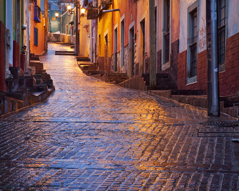Cobblestone Alley at Dusk — Orange