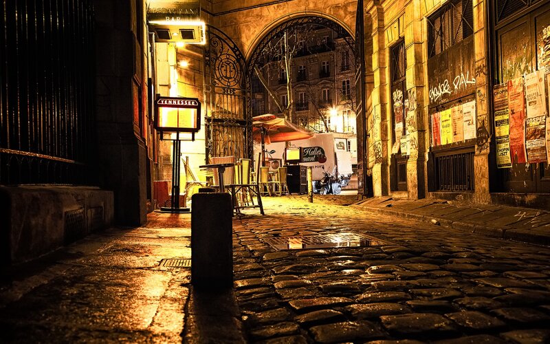 Cobblestone alley at night