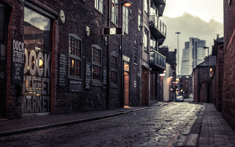 Cobblestone Alley with Brick Buildings