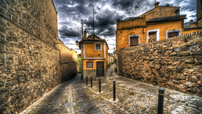 Cobblestone Alley with Buildings — Yellow