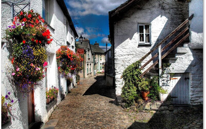 Cobblestone alley with flower baskets