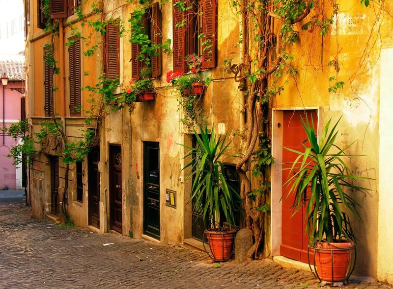 cobblestone alley with ivy-covered buildings