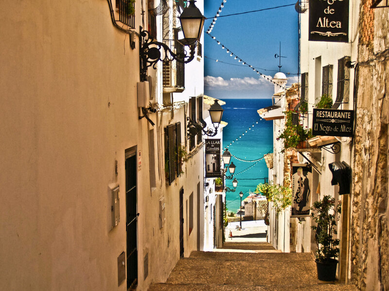 Cobblestone Alley with Sea View