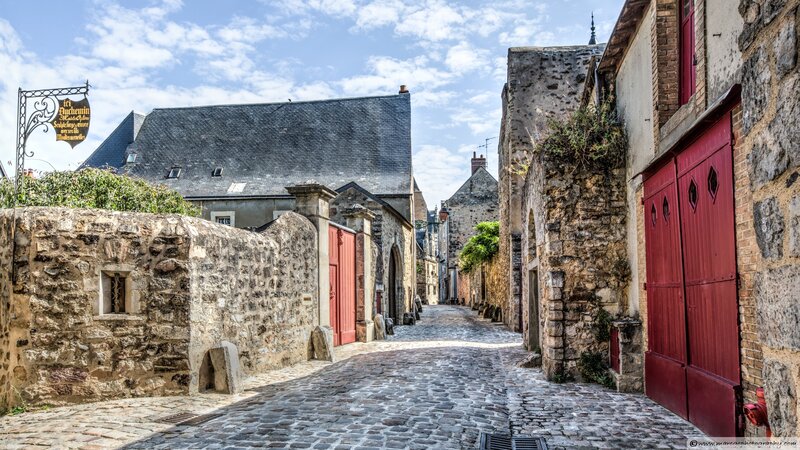 Cobblestone Alley with Stone Buildings