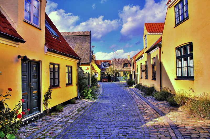 Cobblestone Alley with Yellow Houses