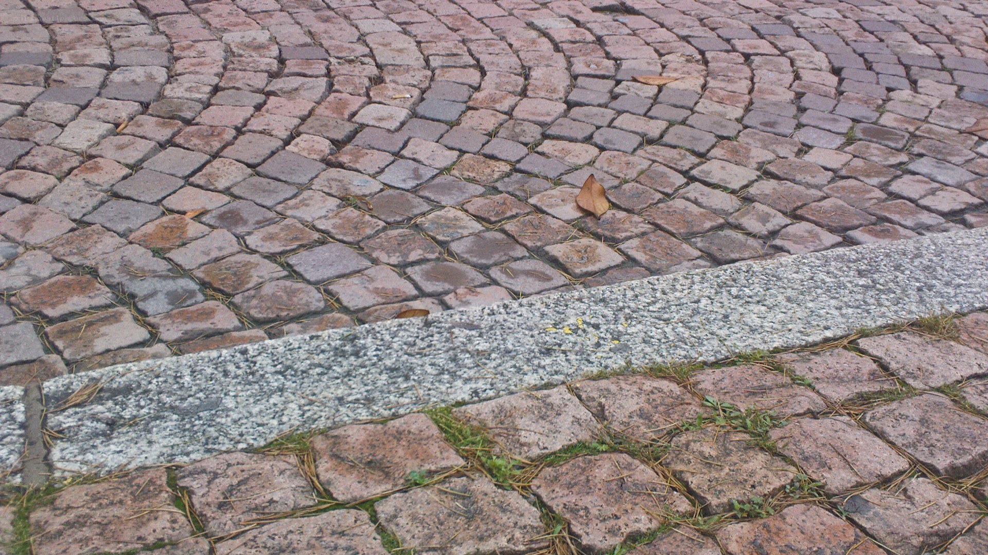 cobblestone pavement with curb