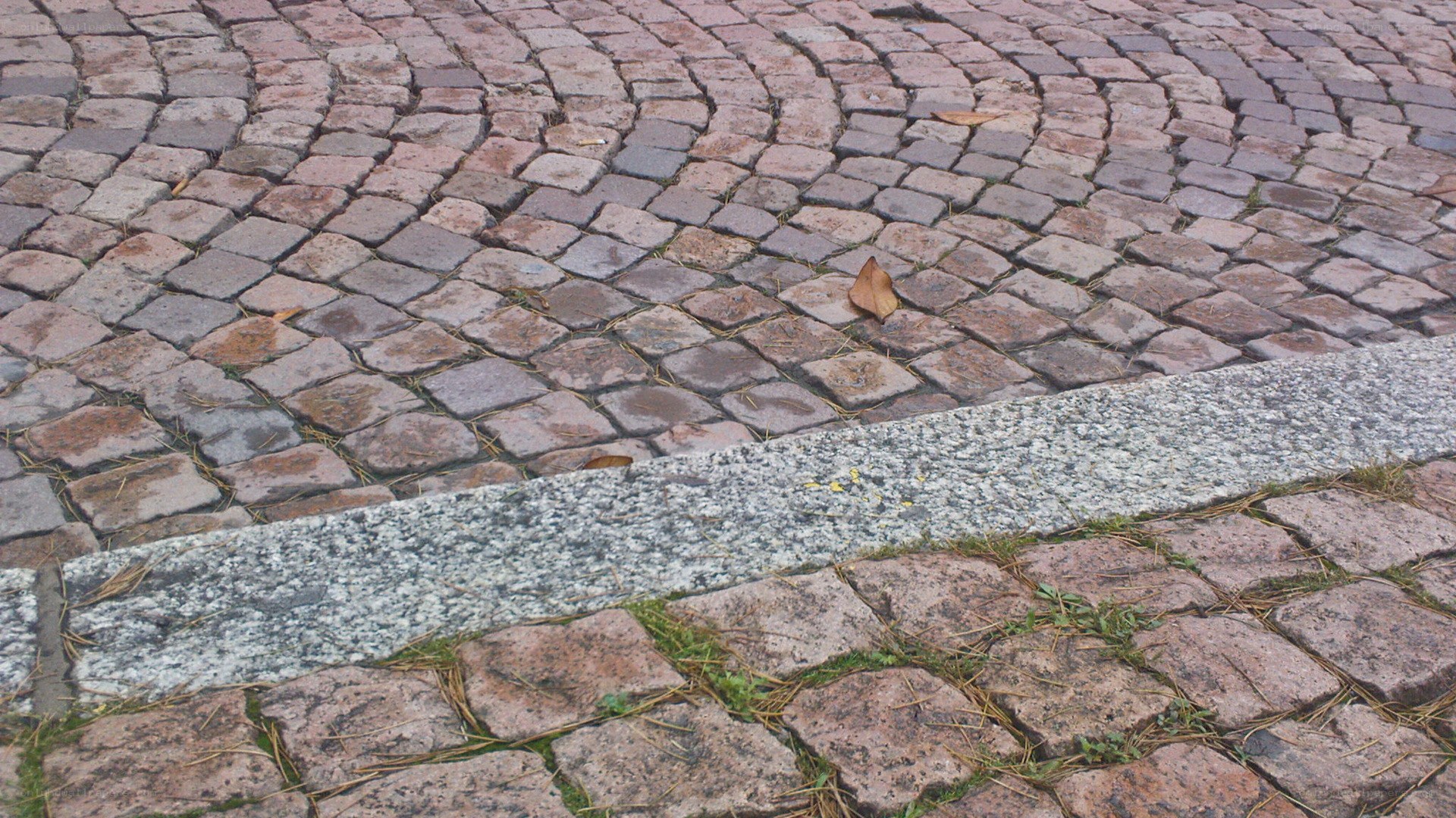 cobblestone pavement with curb