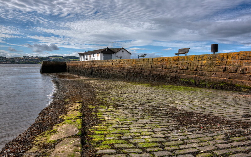 Cobblestone pier at low tide