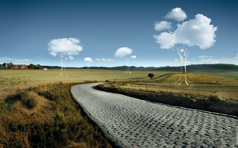 Cobblestone road through fields