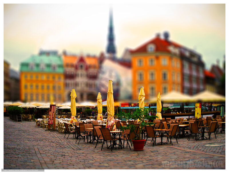 Cobblestone square with cafe tables
