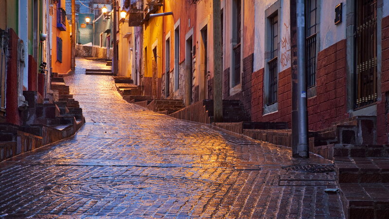 Cobblestone Street at Dusk — Orange, Dramatic
