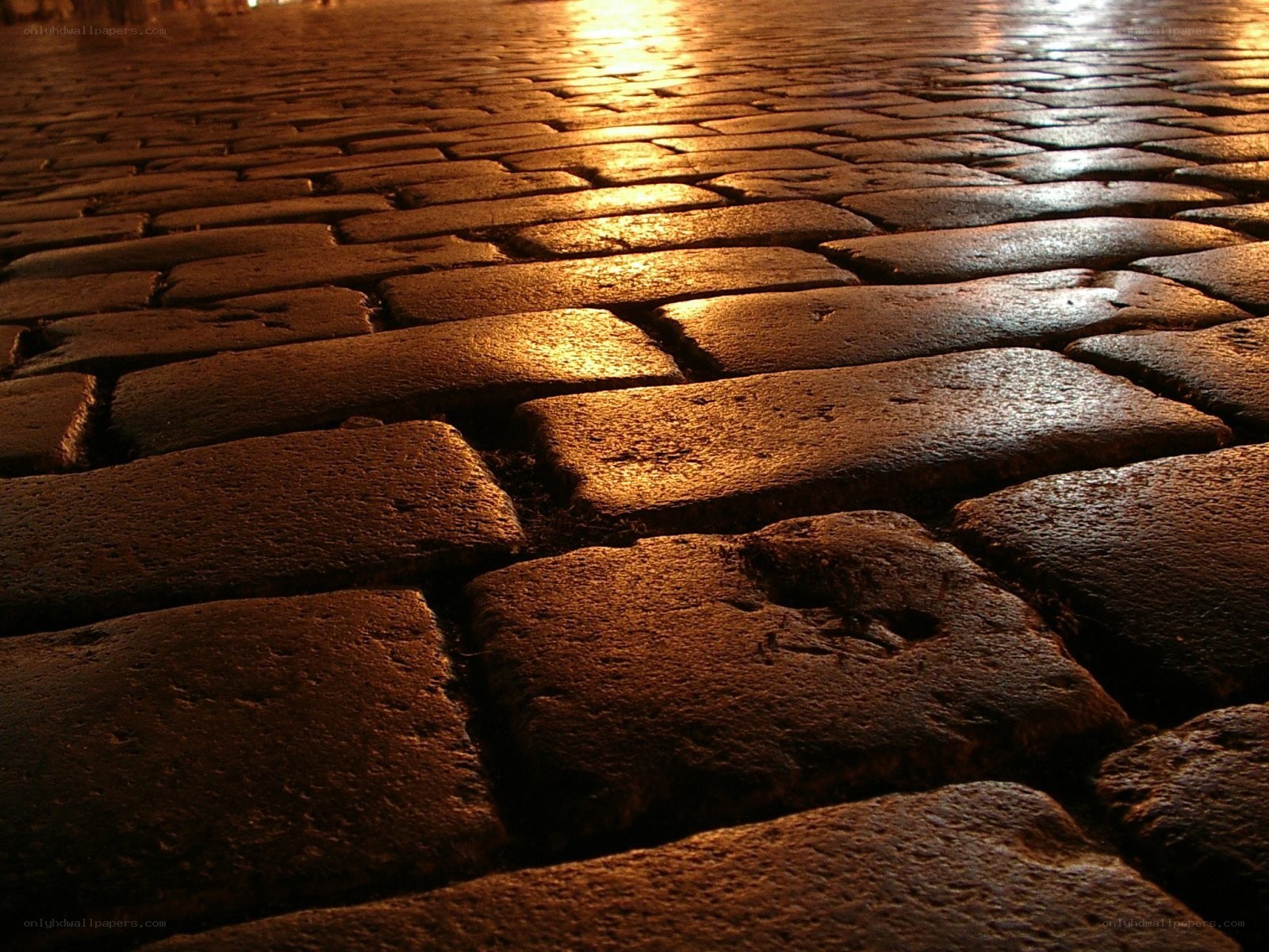 cobblestone street at night