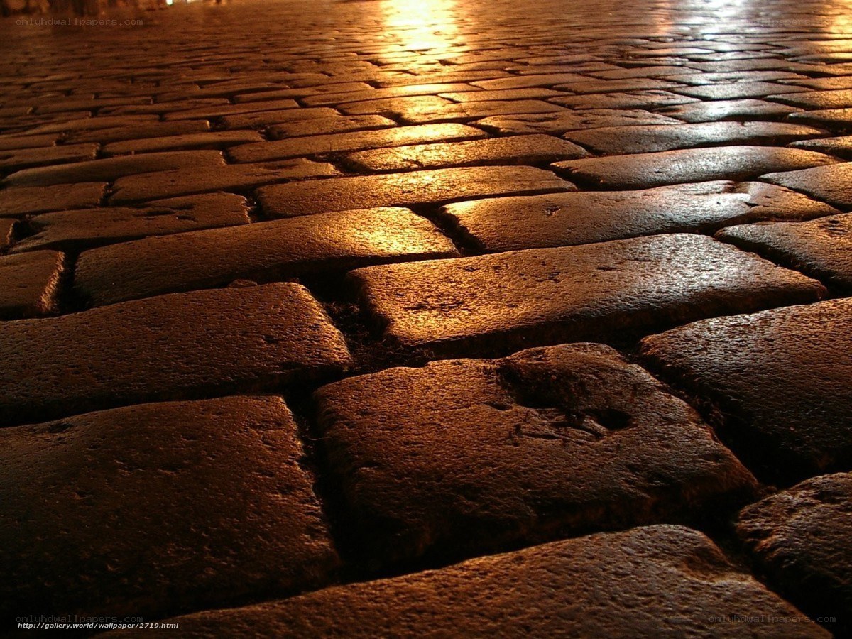 cobblestone street at night