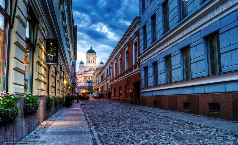 Cobblestone street with cathedral