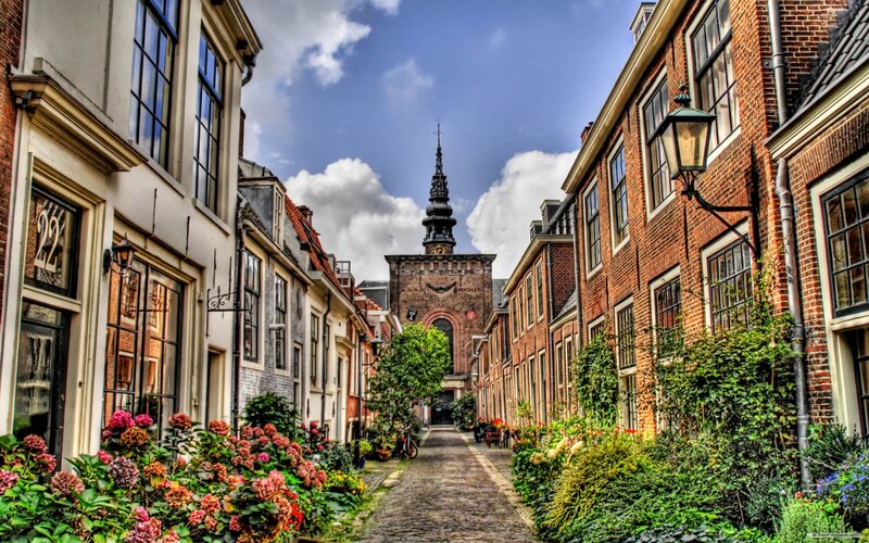 Cobblestone street with church spire