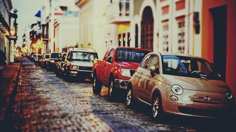 Cobblestone street with parked cars