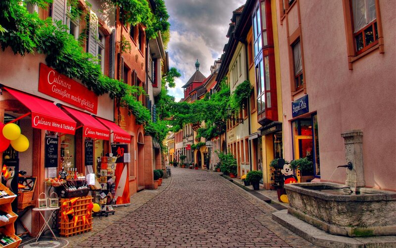 Cobblestone Street with Shops — Red, Serene