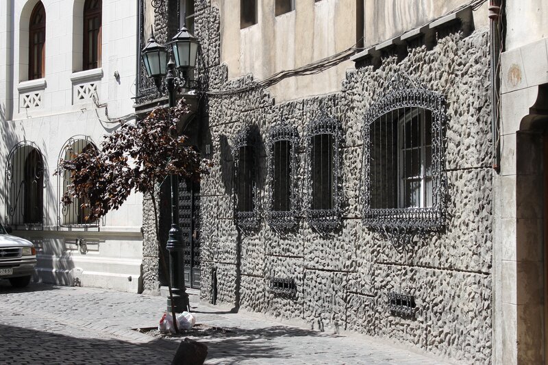 cobblestone street with stone facade