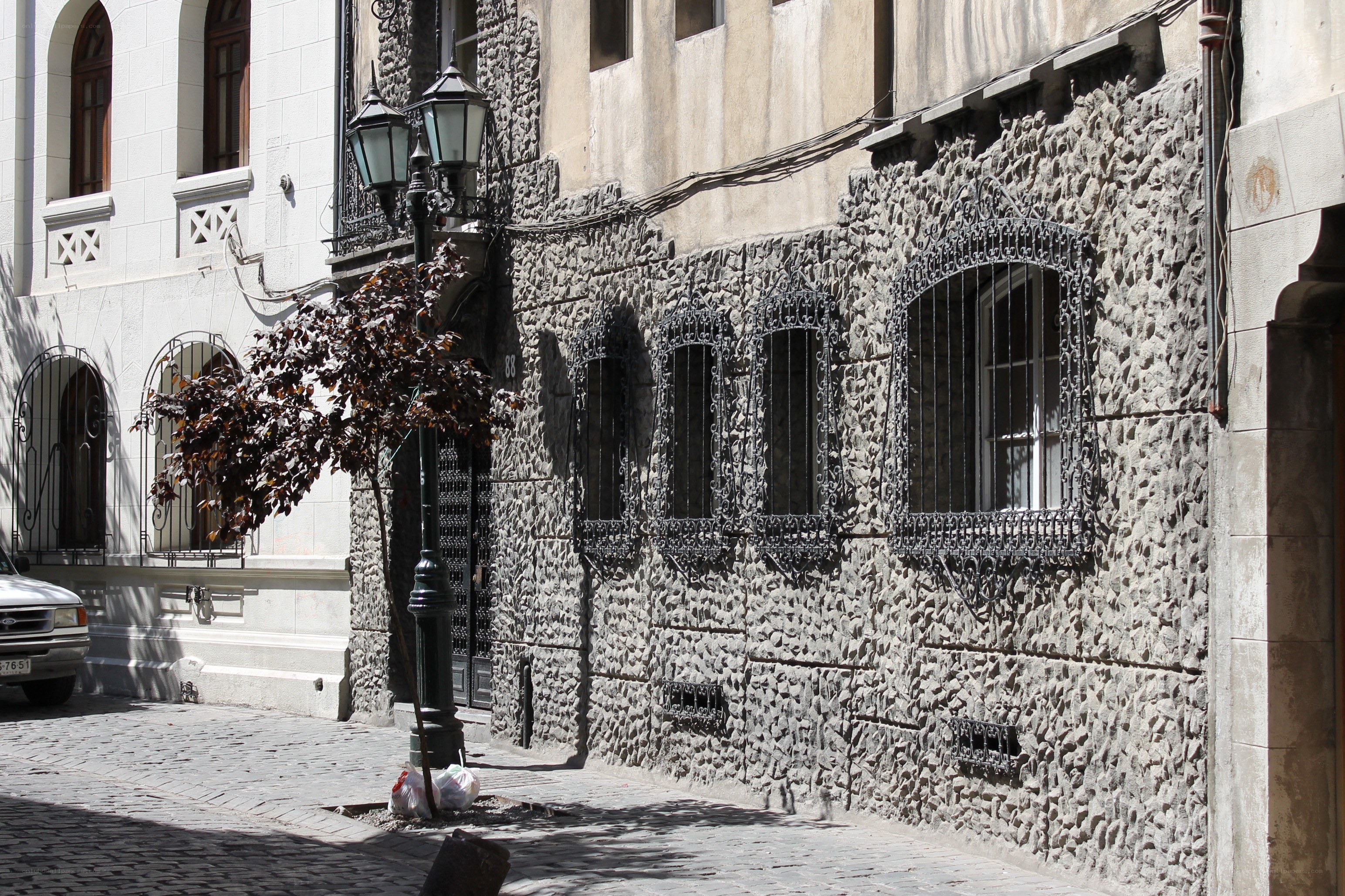 cobblestone street with stone facade