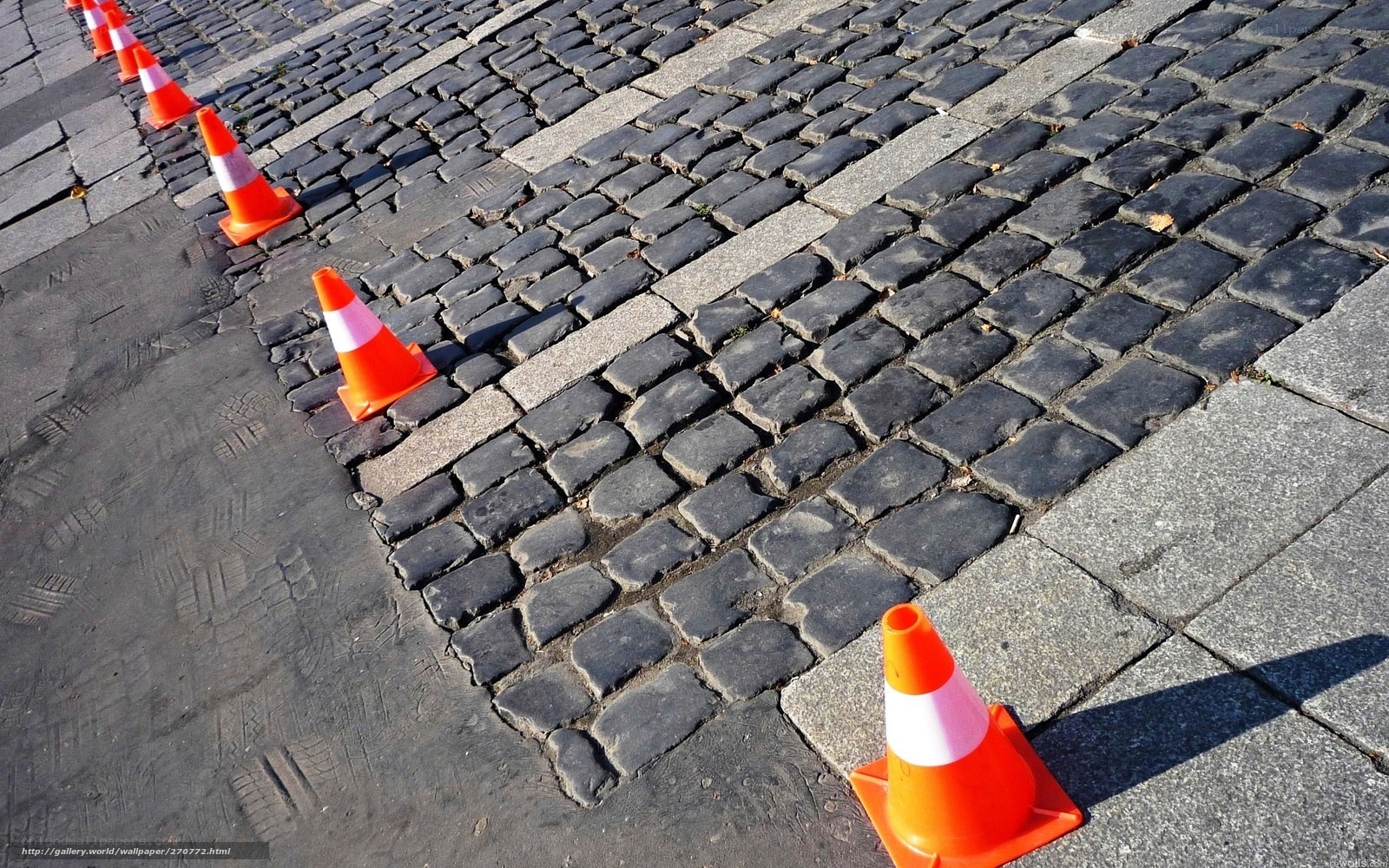 Cobblestone street with traffic cones