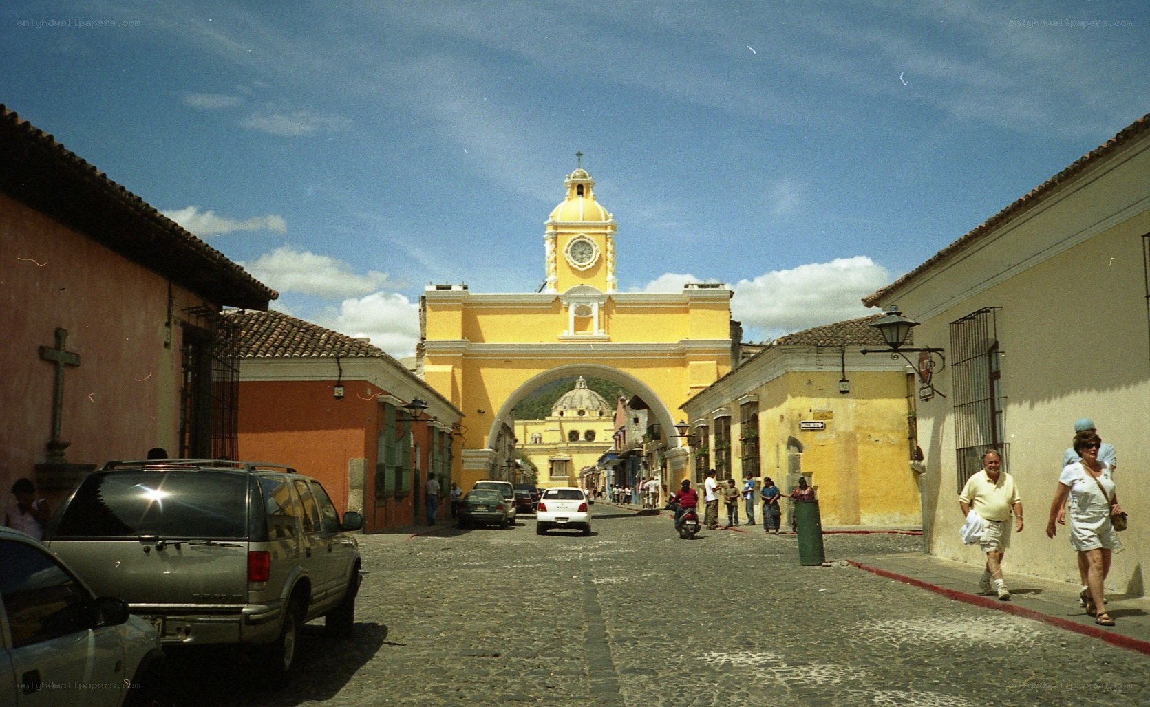 Cobblestone street with yellow arch