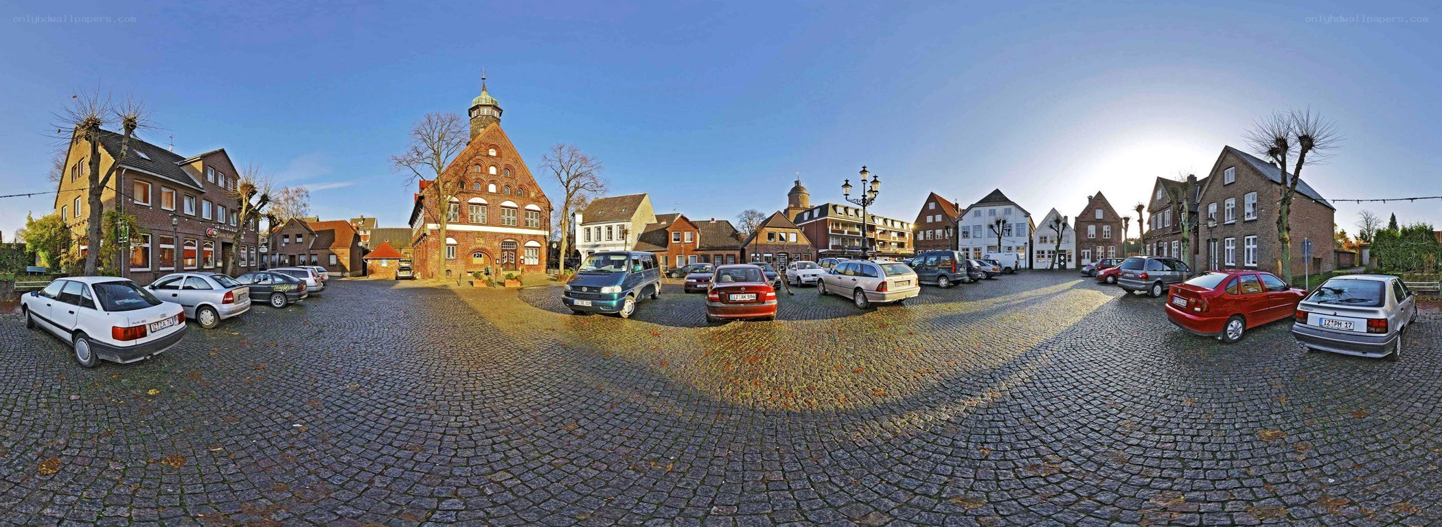 Cobblestone town square with historic buildings