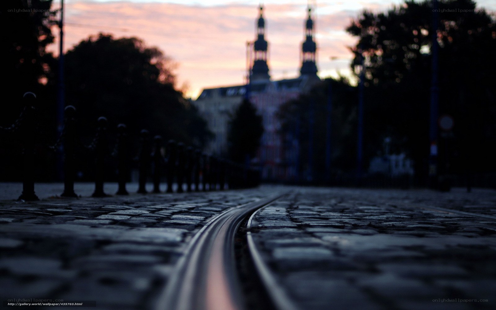 Cobblestone tram tracks at dusk