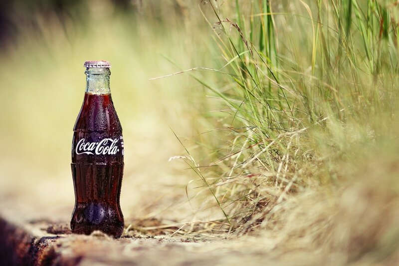 Coca-Cola bottle in grass