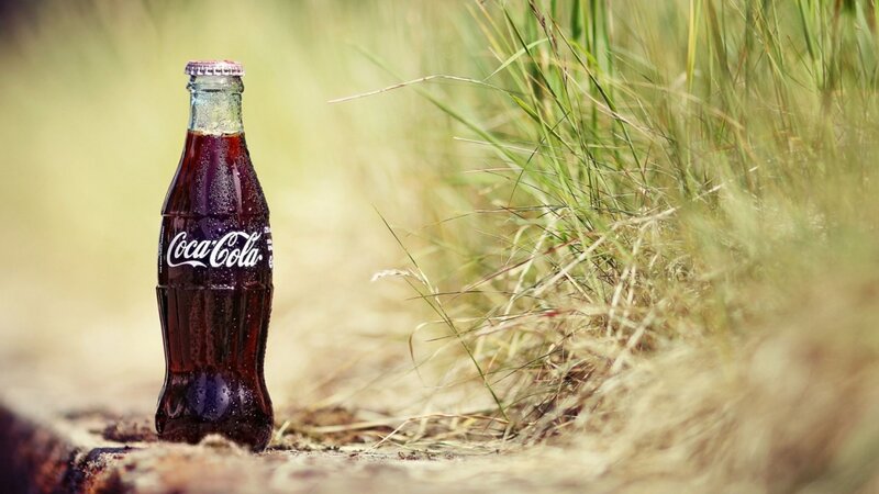 Coca-Cola Bottle in Grass — Brown, Natural, Afternoon