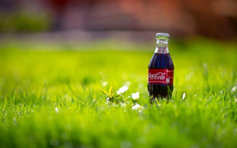 Coca-Cola Bottle in Grass — Green