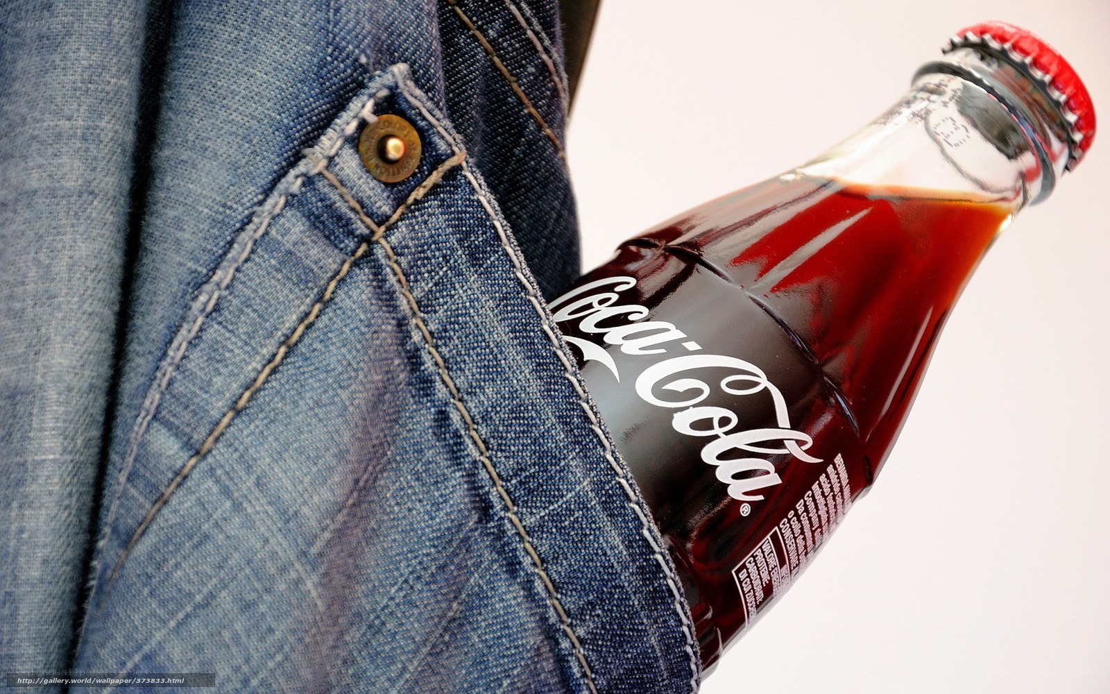 Coca-Cola bottle in jeans pocket