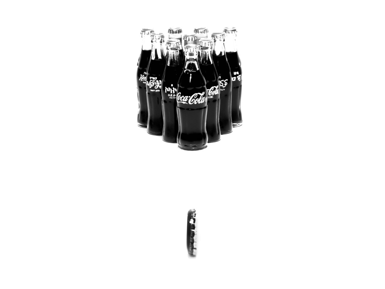 Coca-Cola bottles arranged in a triangle