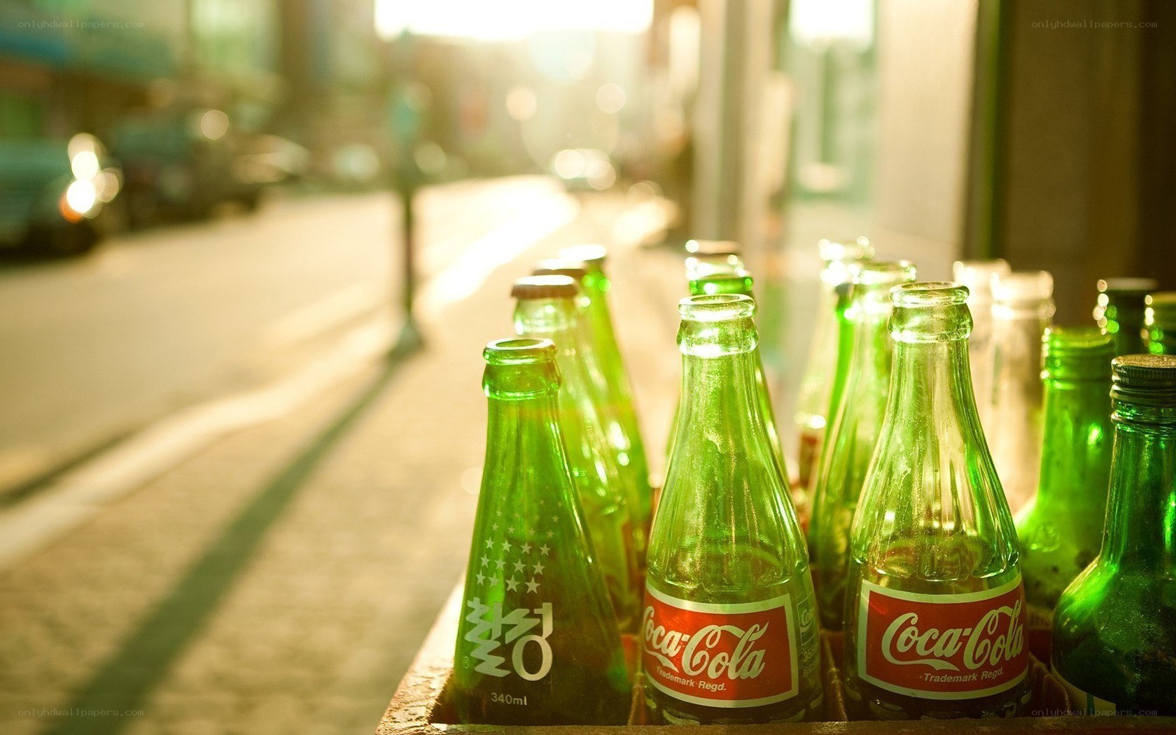 Coca-Cola bottles in sunlight