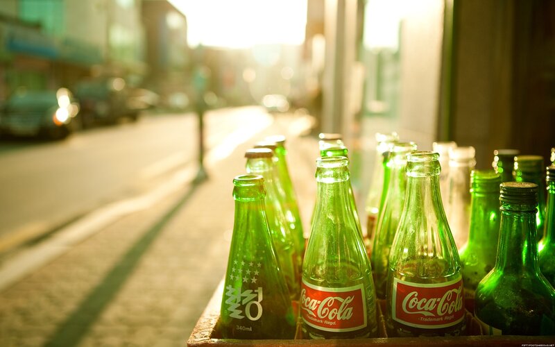 Coca-Cola bottles in sunlight