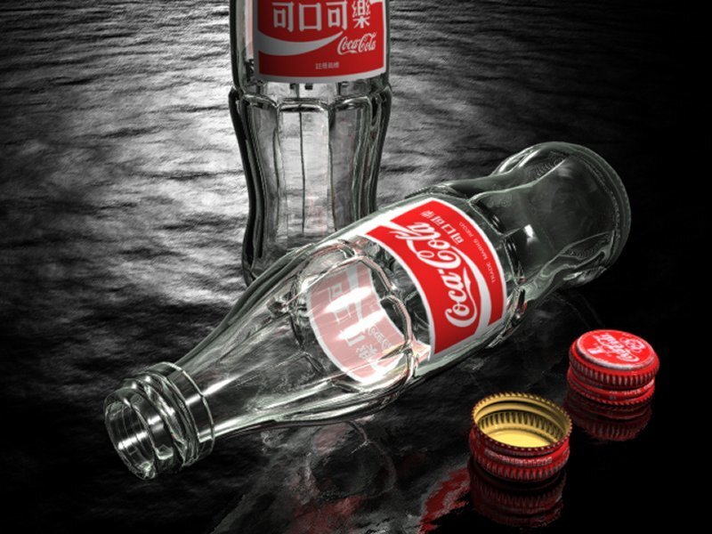 Coca-Cola bottles on dark surface