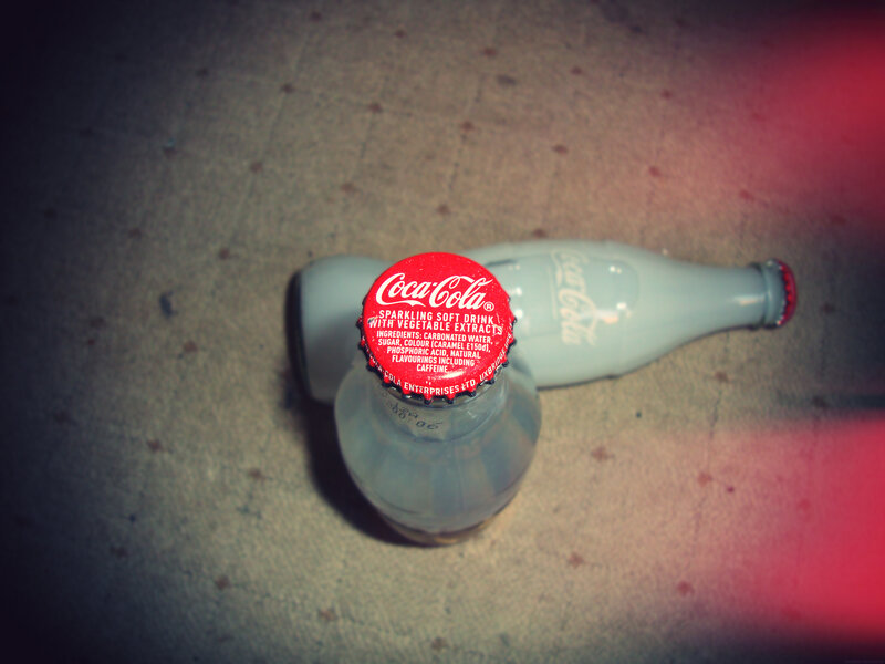 Coca-Cola bottles on floor