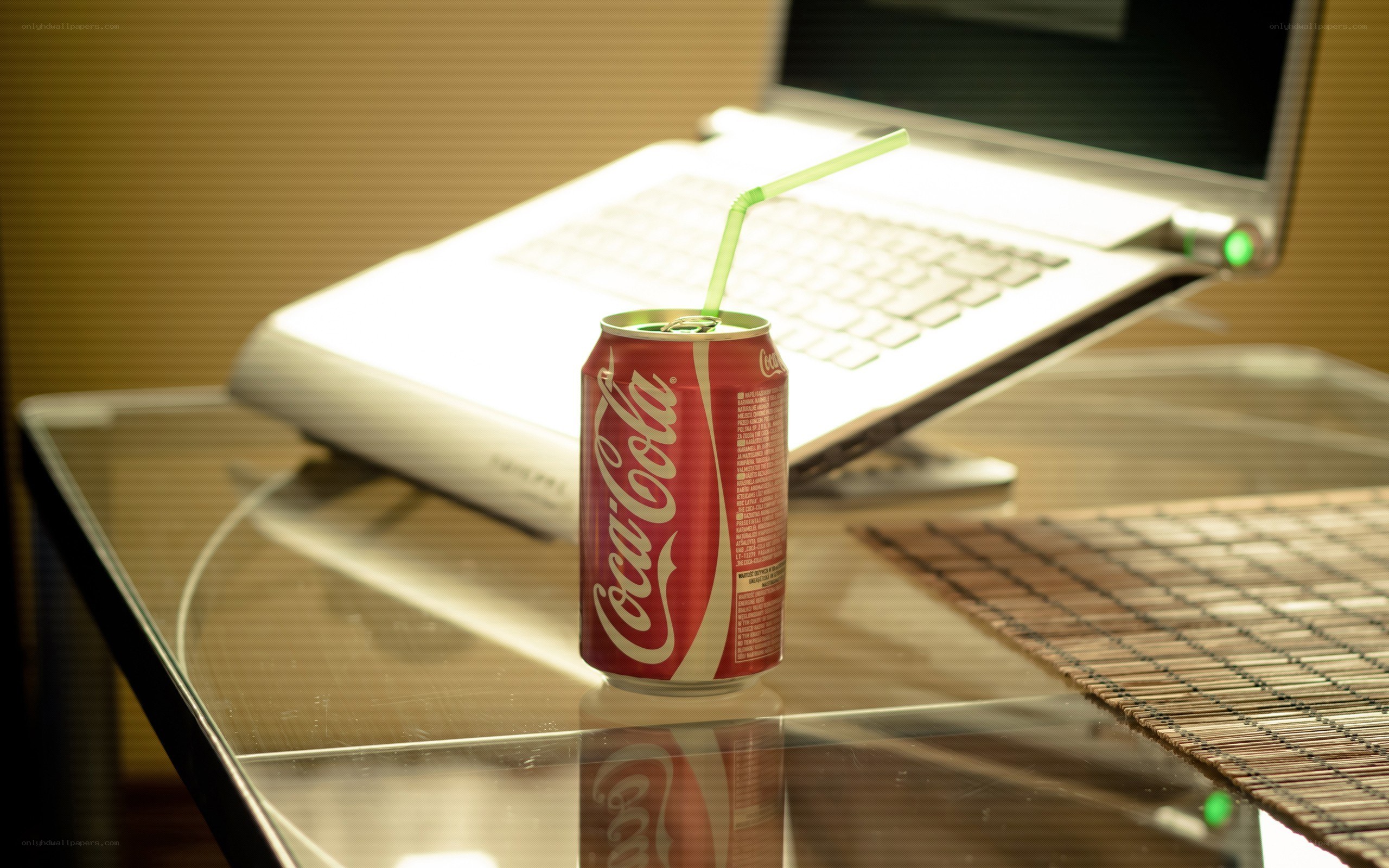 Coca-Cola can on glass table