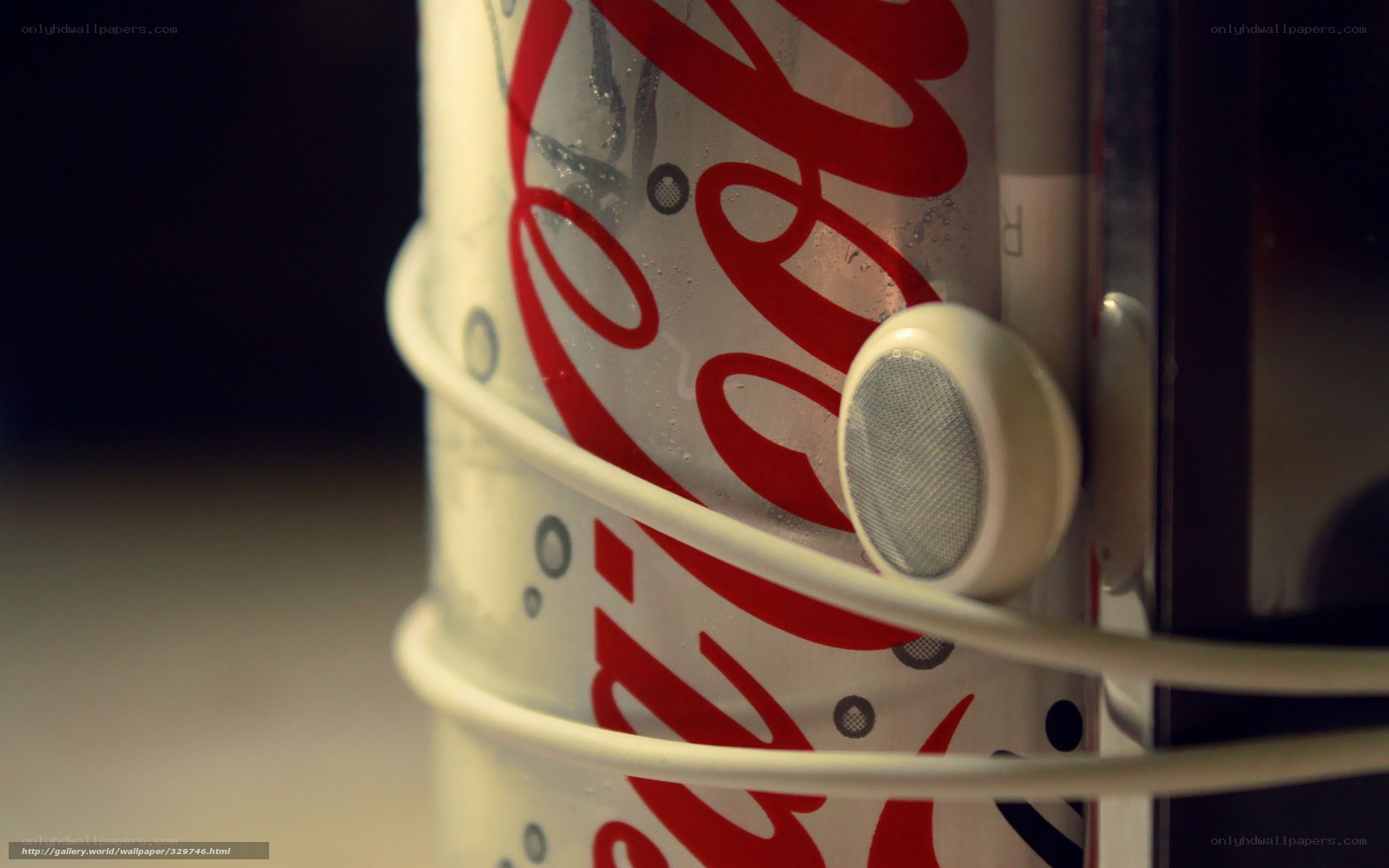 Coca-Cola can with earbuds