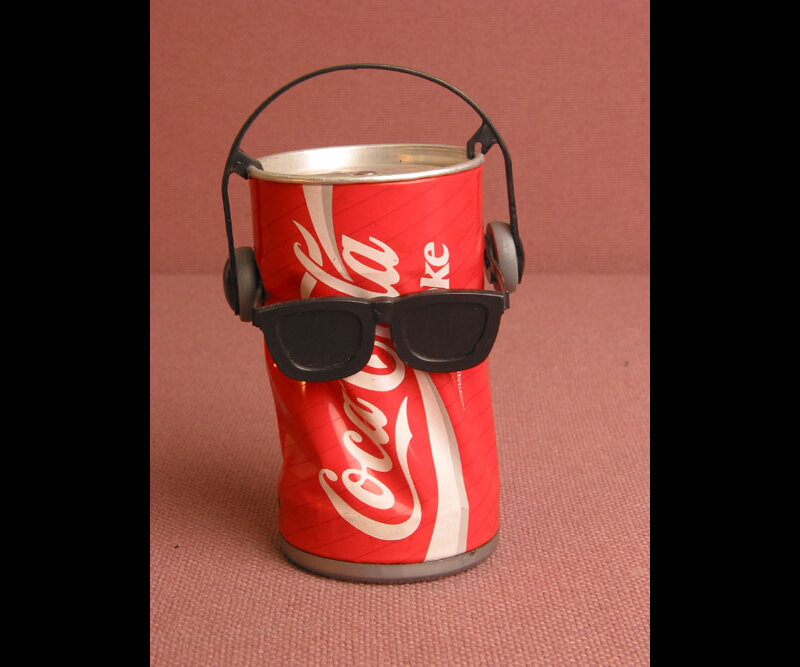Coca-Cola can with headphones and sunglasses