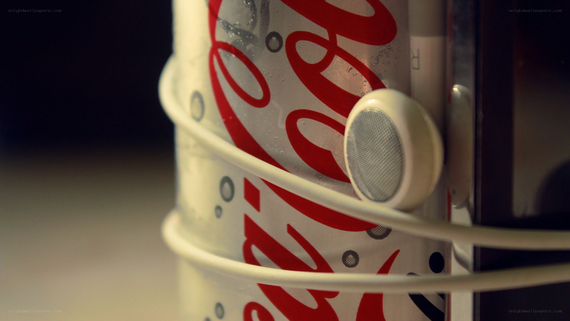 Coca-Cola can with headphones