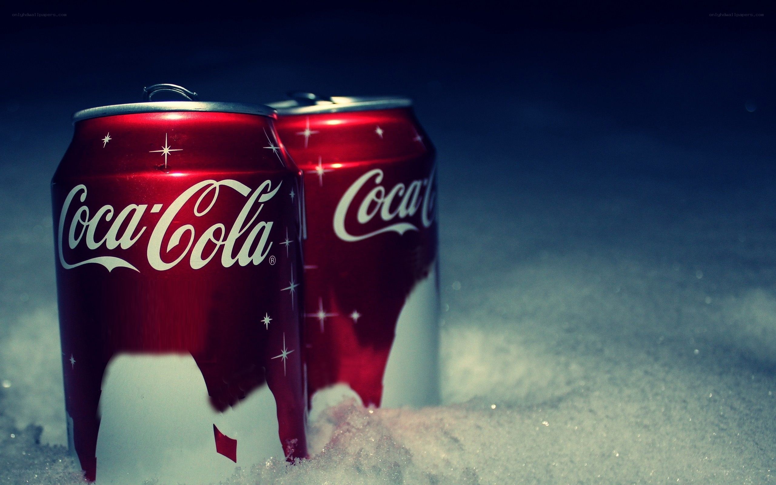 Coca-Cola cans in snow