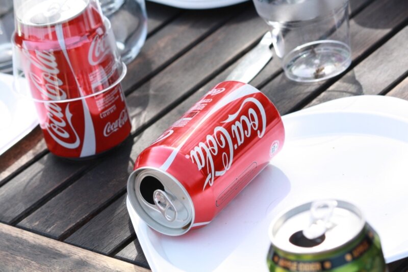 Coca-Cola cans on a table