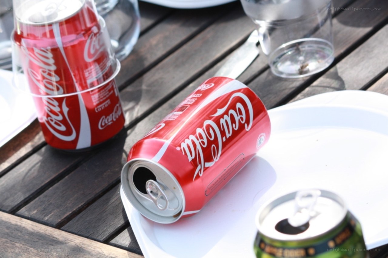 Coca-Cola cans on a table