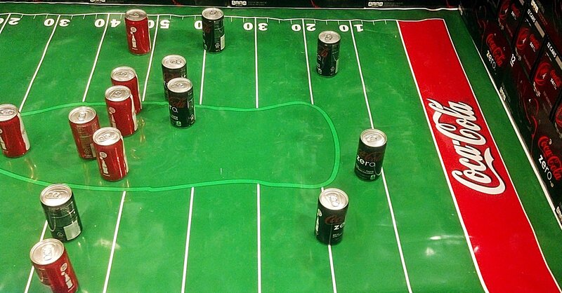 Coca-Cola Cans on Field
