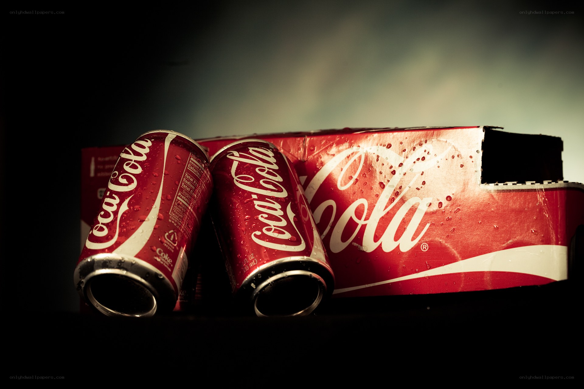 Coca-Cola cans with condensation
