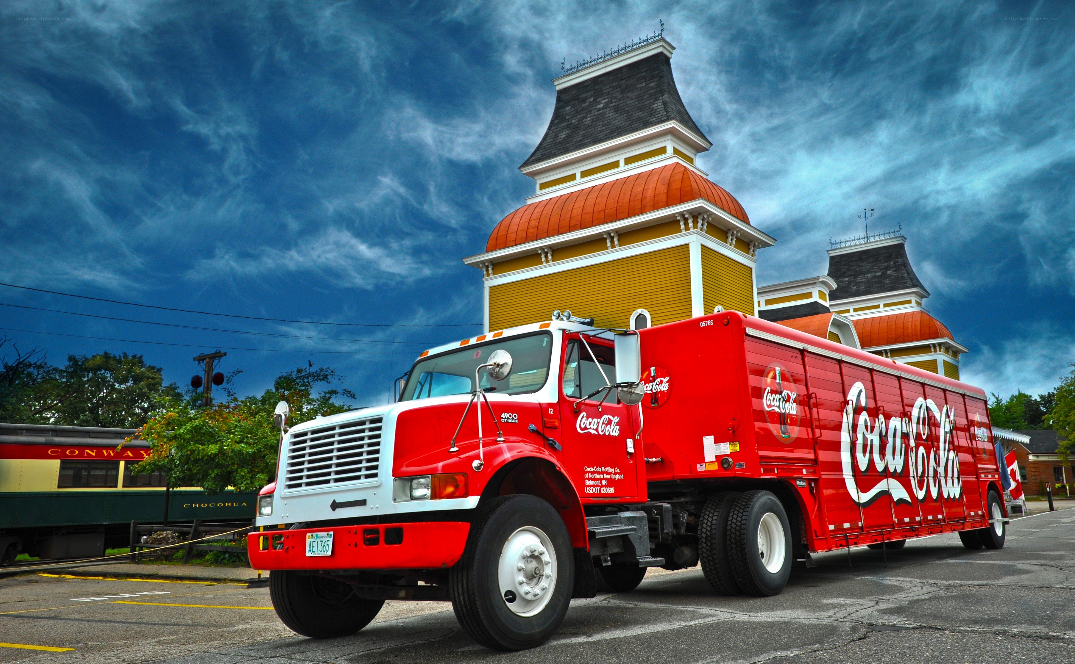 Coca-Cola delivery truck at train station