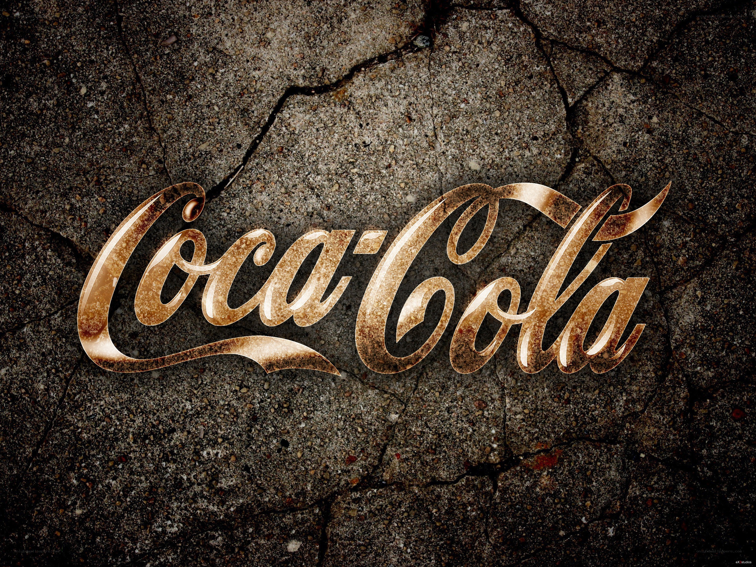 Coca-Cola logo on cracked concrete
